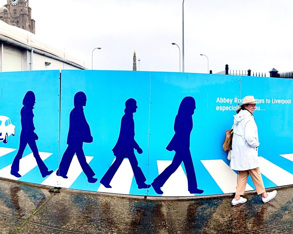 Liverpool mural with Abbey Road silhouettes.