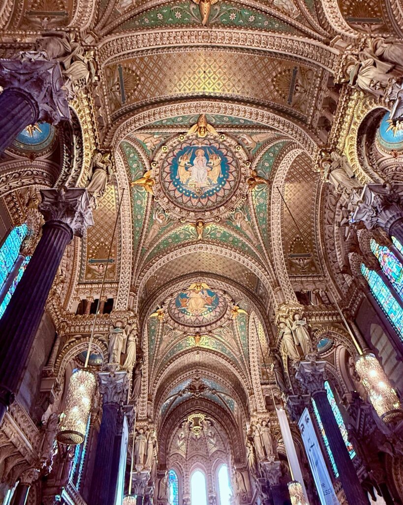 Ornate cathedral ceiling with intricate decor.