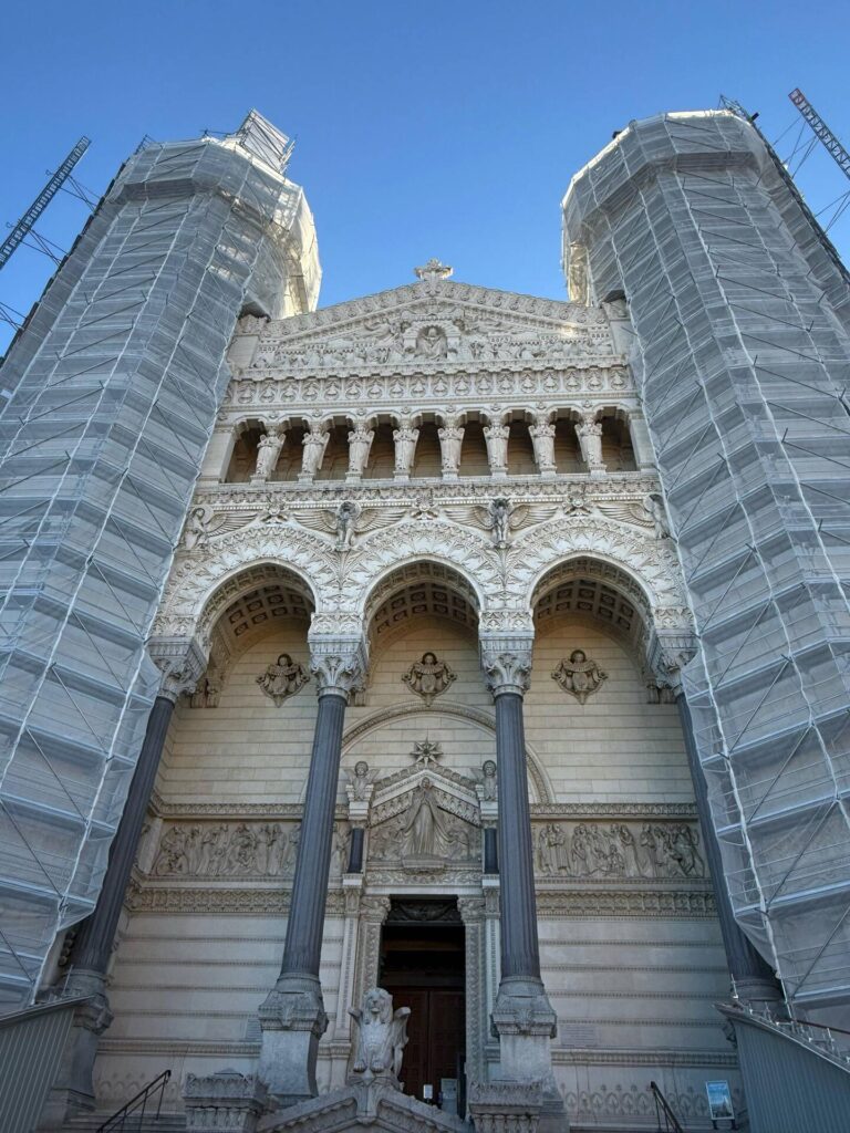 Historic cathedral facade under restoration scaffolding